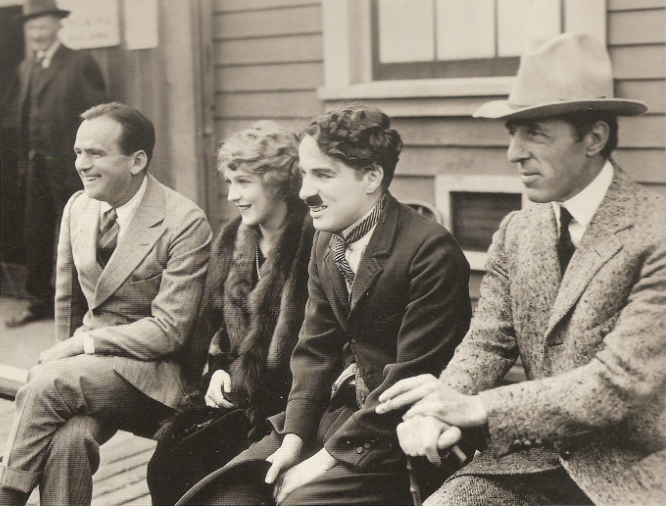 D.W. Griffith, Mary Pickford, Charlie Chaplin and Douglas Fairbanks signing the United Artists contract, 1919